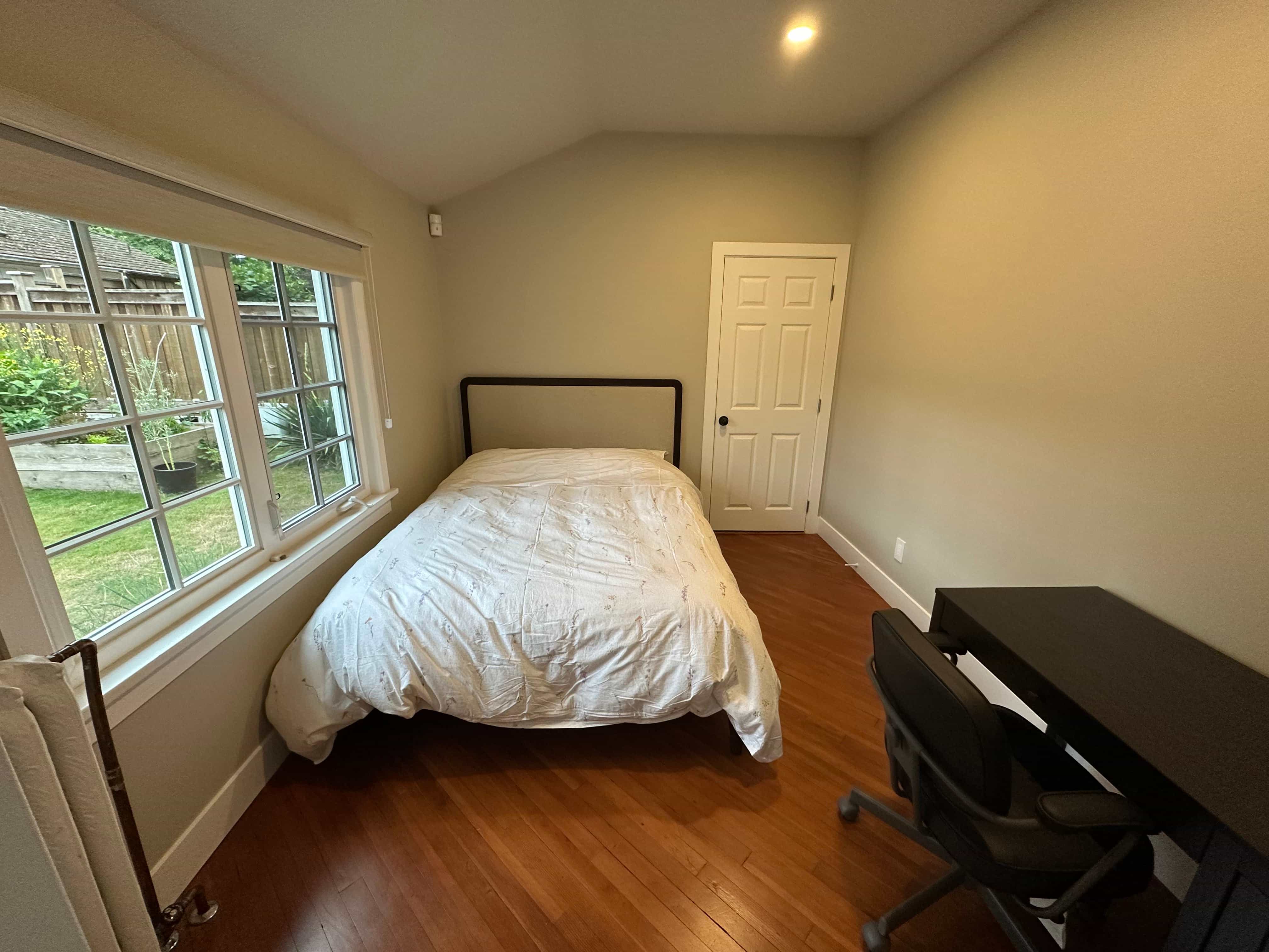 A bedroom with a queen bed